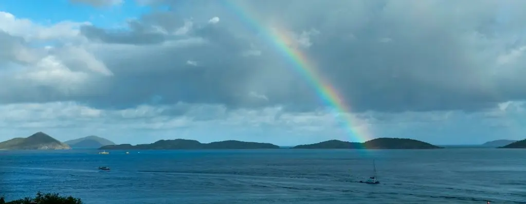 Ocean with islands and rainbow view